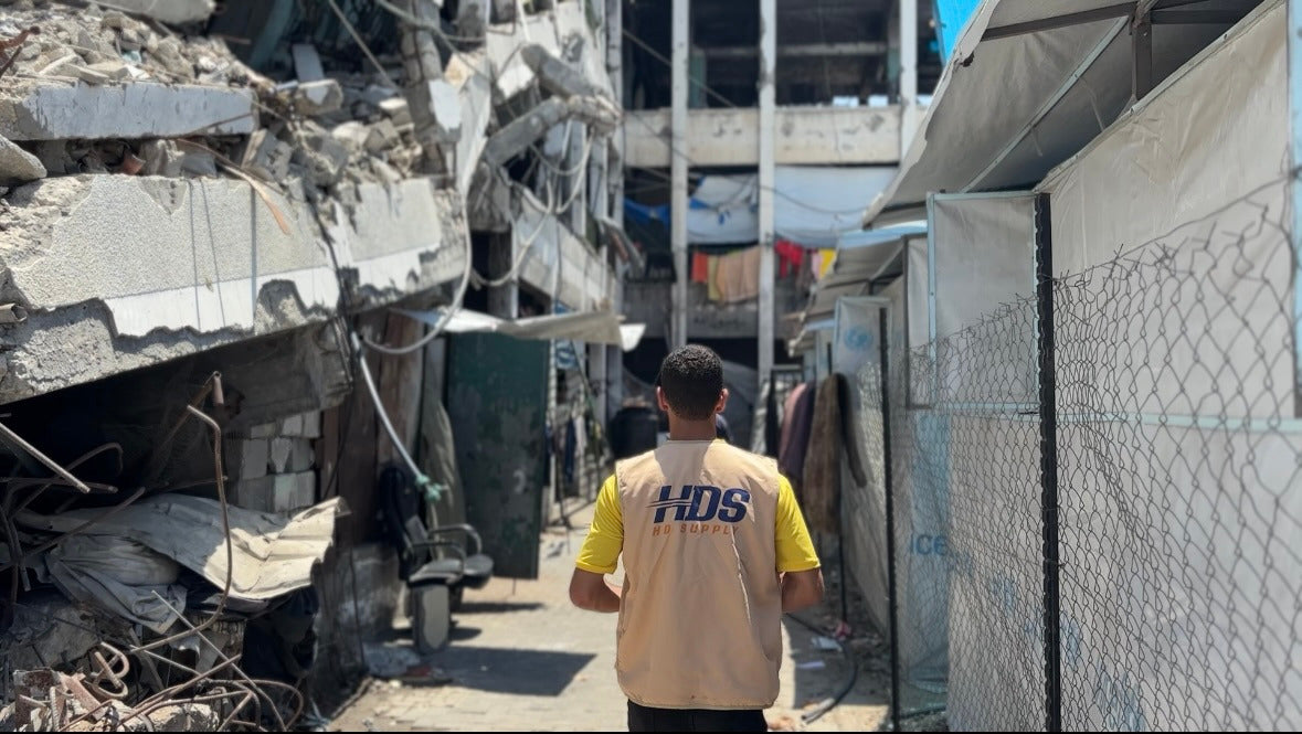 Aid workers preparing hot meals for families in Palestine